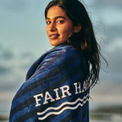The FH Organic Beach Towel | Navy Waves -Fair Harbor Clothing Shop towel onmodel d88cfc96 8e65 4c40 b901 f5532bee0e97